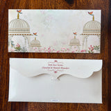 cream-colored background with a delicate illustration of domed architecture, small birds, and pink floral accents. personalized money envelopes