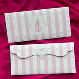 Two pink and white striped personalized princess theme gift money envelopes with bow patterns.